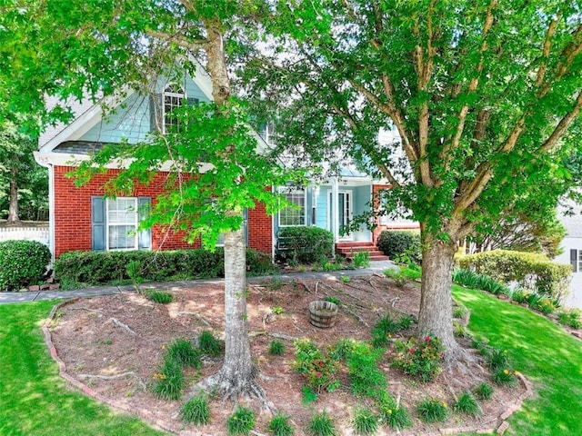 662 Shady Willow Ln, Loganville, GA 30052 - obstructed view of property featuring brick siding and a front yard