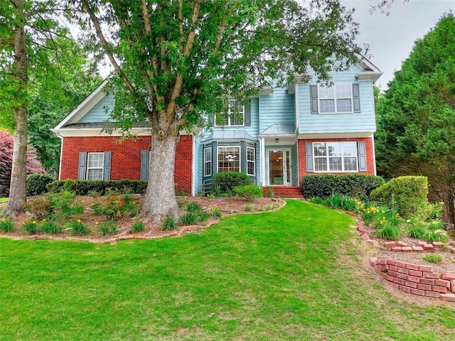 662 Shady Willow Ln, Loganville, GA 30052 - view of front of house with brick siding and a front lawn
