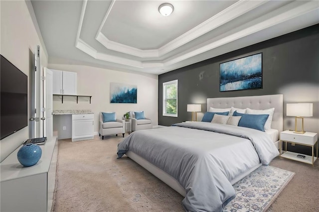 bedroom featuring a tray ceiling, light colored carpet, and ornamental molding