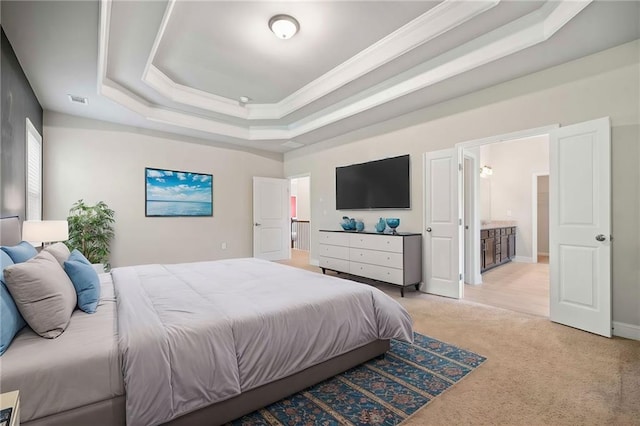 bedroom with visible vents, ornamental molding, ensuite bathroom, a raised ceiling, and light colored carpet