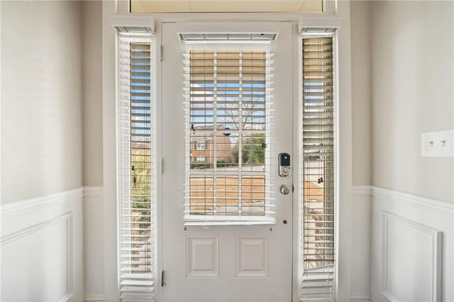 entryway featuring wainscoting