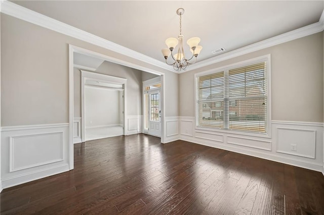 unfurnished dining area with visible vents, a notable chandelier, dark wood-style floors, and ornamental molding