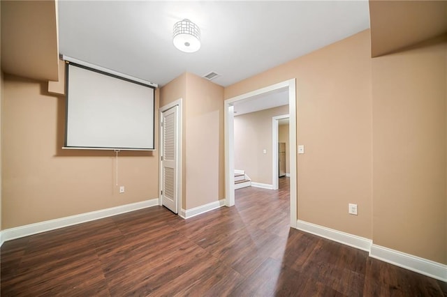 interior space featuring visible vents, baseboards, and wood finished floors