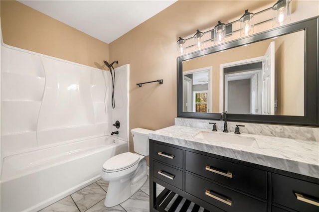 full bathroom featuring vanity, toilet, marble finish floor, and shower / bathtub combination