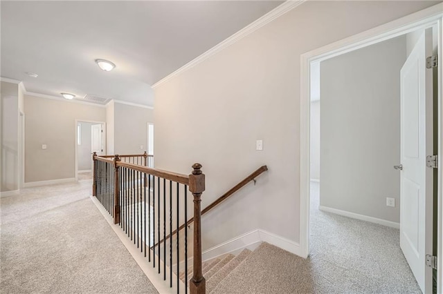 stairs featuring carpet flooring, visible vents, crown molding, and baseboards