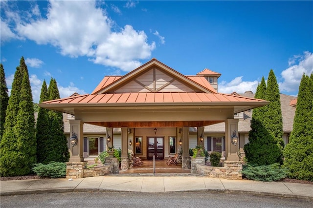 view of front of house featuring a standing seam roof and metal roof