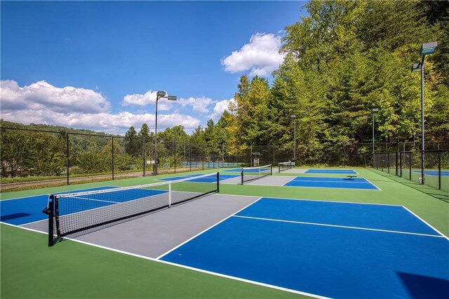 view of sport court with community basketball court and fence