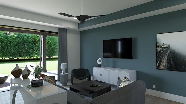 living room featuring baseboards, ceiling fan, and wood finished floors