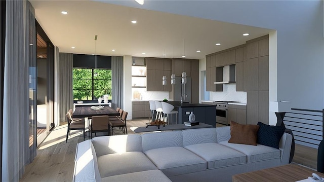living area with recessed lighting and light wood-style floors