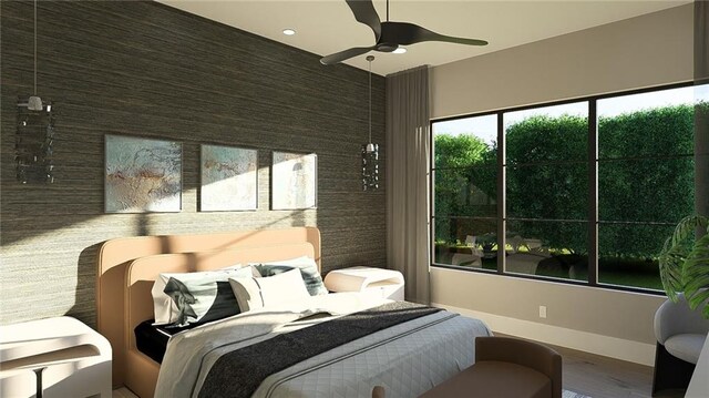 bedroom with baseboards, a ceiling fan, wood finished floors, and an accent wall