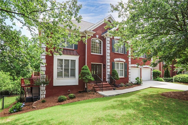 740 Creek Wind Ct, Duluth, GA 30097 - colonial home featuring driveway, brick siding, and an attached garage