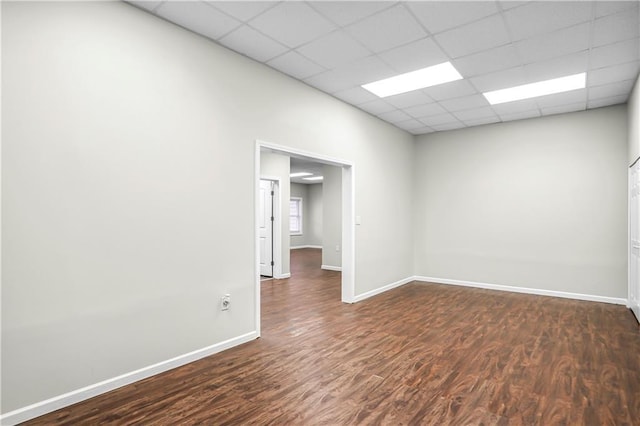 740 Creek Wind Ct, Duluth, GA 30097 - empty room featuring dark wood-style flooring, baseboards, and a drop ceiling