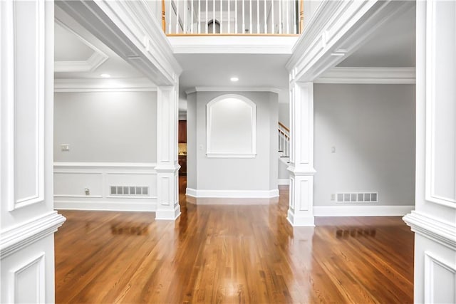 740 Creek Wind Ct, Duluth, GA 30097 - entrance foyer with crown molding, decorative columns, stairs, wood finished floors, and recessed lighting