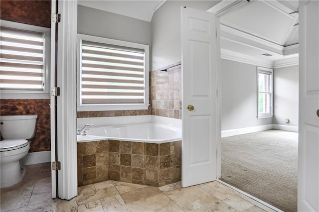 740 Creek Wind Ct, Duluth, GA 30097 - full bathroom featuring tiled tub, crown molding, toilet, and baseboards