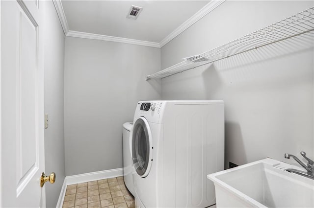 740 Creek Wind Ct, Duluth, GA 30097 - washroom featuring washing machine and clothes dryer, ornamental molding, and baseboards