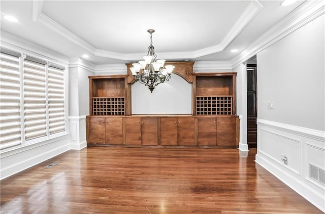 740 Creek Wind Ct, Duluth, GA 30097 - wine area with a chandelier, wood finished floors, wainscoting, ornamental molding, and recessed lighting