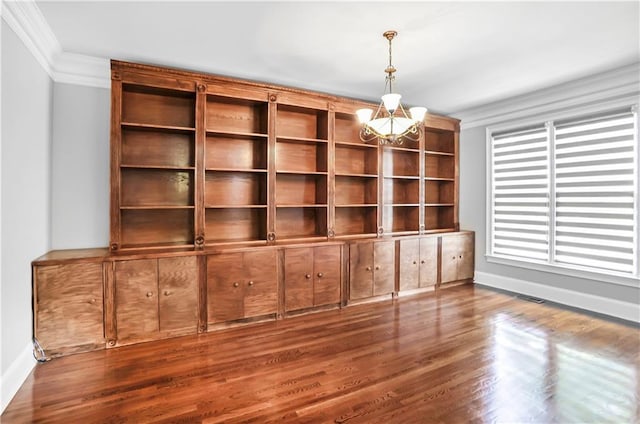 740 Creek Wind Ct, Duluth, GA 30097 - unfurnished room with ornamental molding, a chandelier, baseboards, and wood finished floors