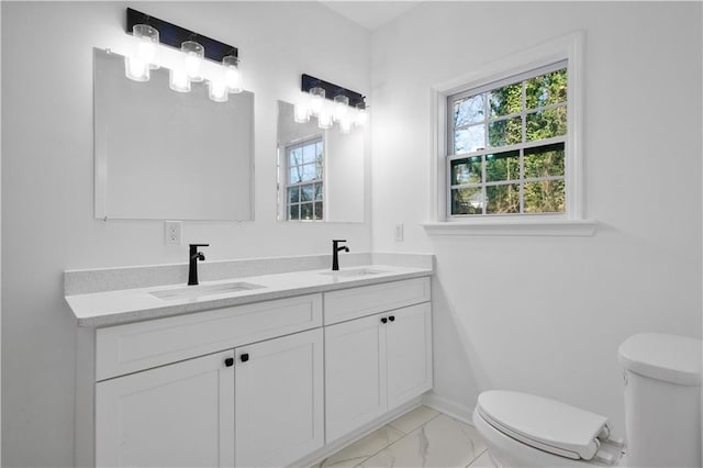 bathroom with vanity and toilet