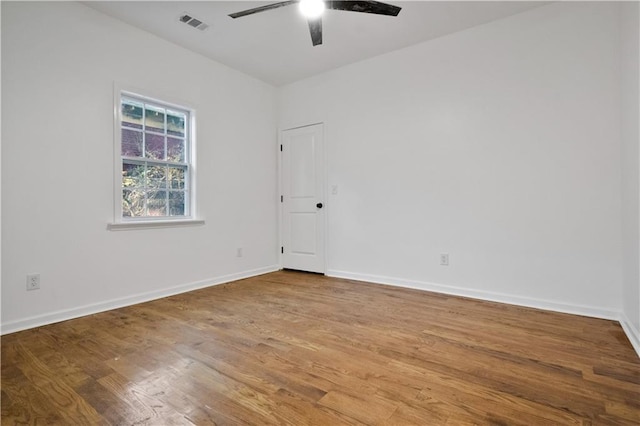 unfurnished room with hardwood / wood-style flooring and ceiling fan