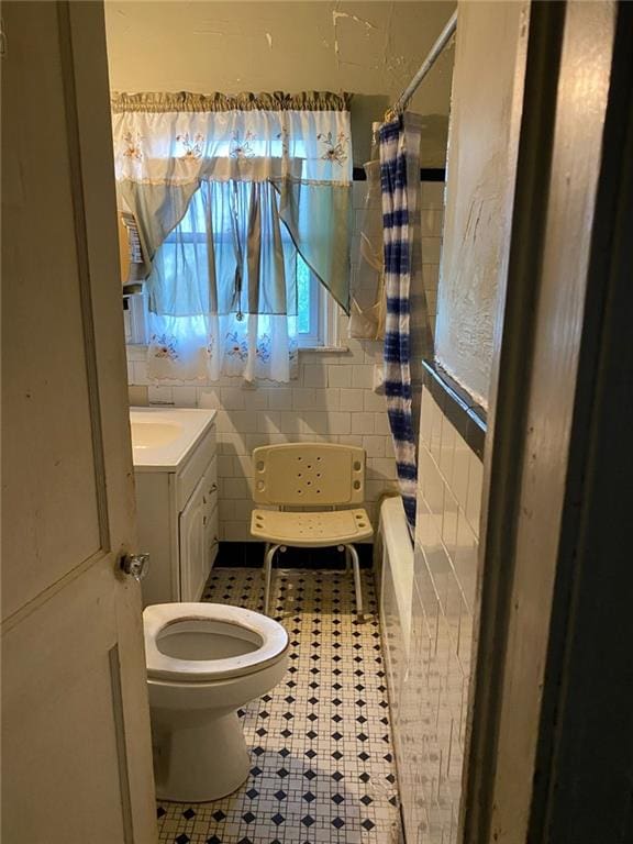 2689 Knox St NE, Atlanta, GA 30317 - bathroom with vanity, tile patterned floors, a shower with curtain, and toilet