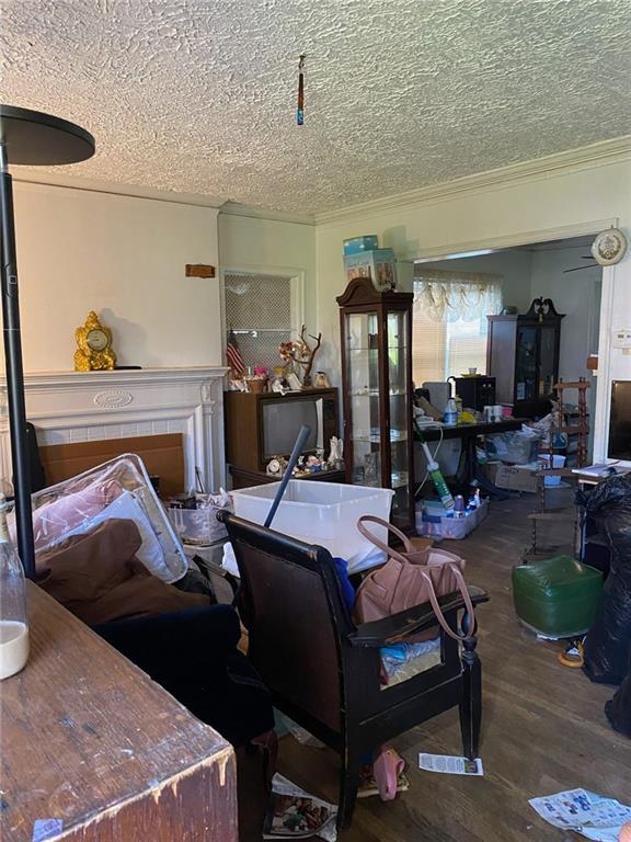 2689 Knox St NE, Atlanta, GA 30317 - interior space with a textured ceiling, ornamental molding, and wood finished floors