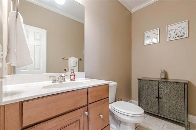 bathroom featuring toilet, crown molding, vanity, and tile patterned flooring