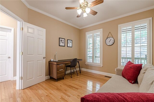 home office featuring crown molding, hardwood / wood-style flooring, and ceiling fan