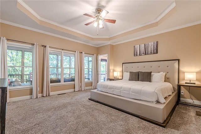 bedroom with ceiling fan, ornamental molding, and multiple windows