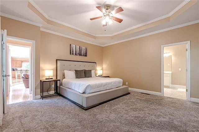 bedroom with ornamental molding, carpet, a raised ceiling, and ceiling fan