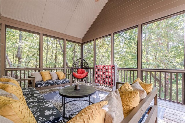 sunroom / solarium with vaulted ceiling