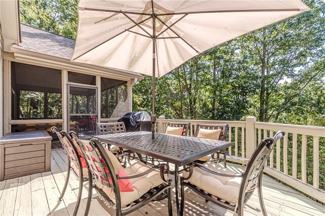 deck with a sunroom