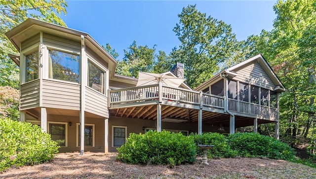 back of property featuring a sunroom