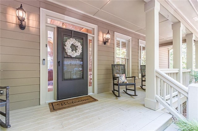 doorway to property featuring a porch