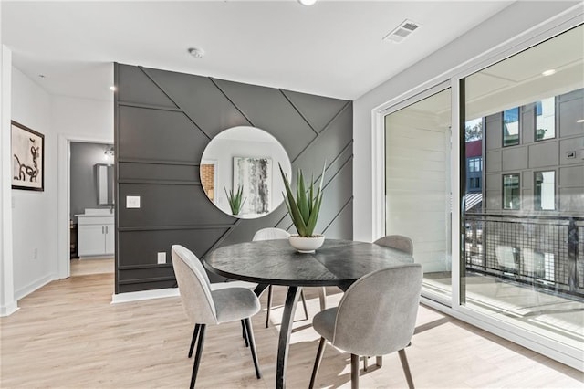 dining space featuring light hardwood / wood-style floors