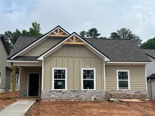 361 Creek Wood Park Dr, Ball Ground, GA 30107 - craftsman-style home featuring a shingled roof, board and batten siding, and stone siding