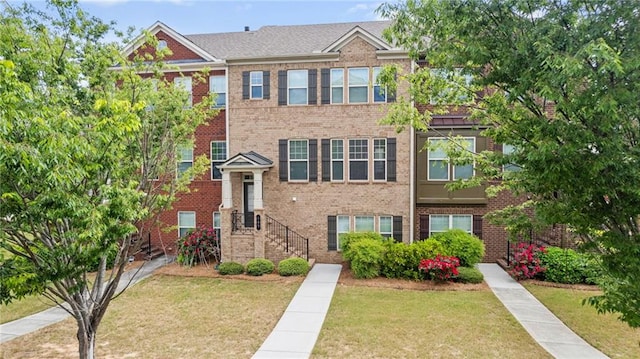 705 Ayala Pl, Alpharetta, GA 30004 - view of property featuring brick siding and a front yard