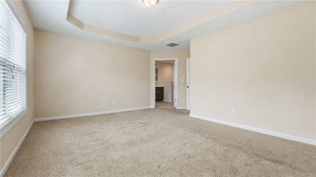 705 Ayala Pl, Alpharetta, GA 30004 - carpeted spare room with baseboards, a raised ceiling, and visible vents