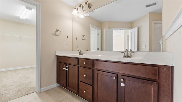 705 Ayala Pl, Alpharetta, GA 30004 - bathroom with a sink, a spacious closet, double vanity, and visible vents
