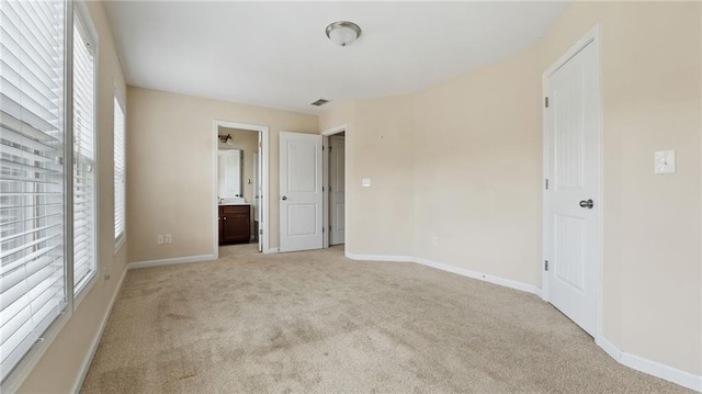 705 Ayala Pl, Alpharetta, GA 30004 - unfurnished bedroom featuring baseboards, light carpet, ensuite bath, and visible vents