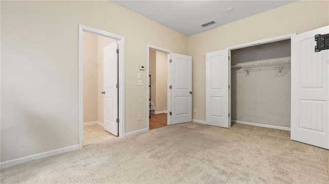 705 Ayala Pl, Alpharetta, GA 30004 - unfurnished bedroom with a closet, carpet, baseboards, and visible vents