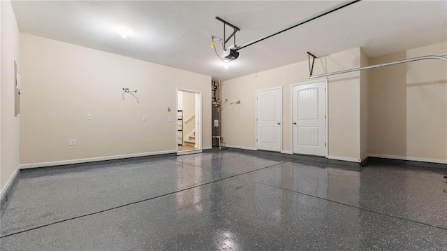 705 Ayala Pl, Alpharetta, GA 30004 - garage featuring water heater, baseboards, and a garage door opener