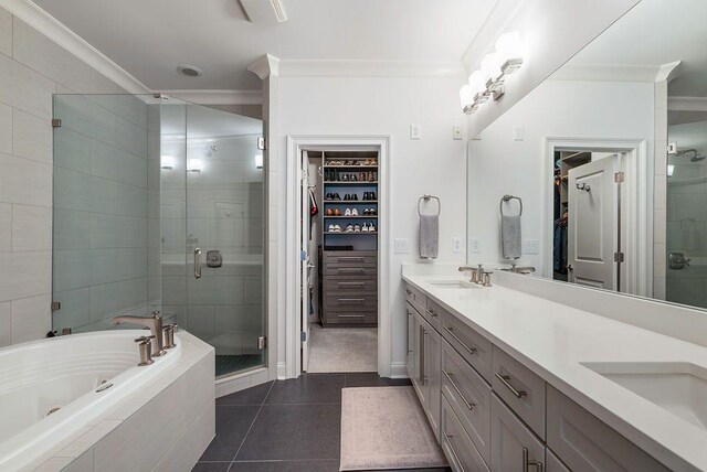 bathroom with tile patterned flooring, vanity, separate shower and tub, and ornamental molding