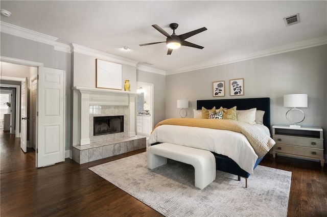 1003 N Ave NE, Atlanta, GA 30306 - bedroom featuring crown molding, dark wood-style floors, a high end fireplace, a ceiling fan, and connected bathroom