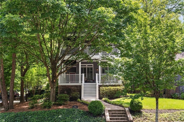 1003 N Ave NE, Atlanta, GA 30306 - obstructed view of property with stairway, a balcony, and a front lawn