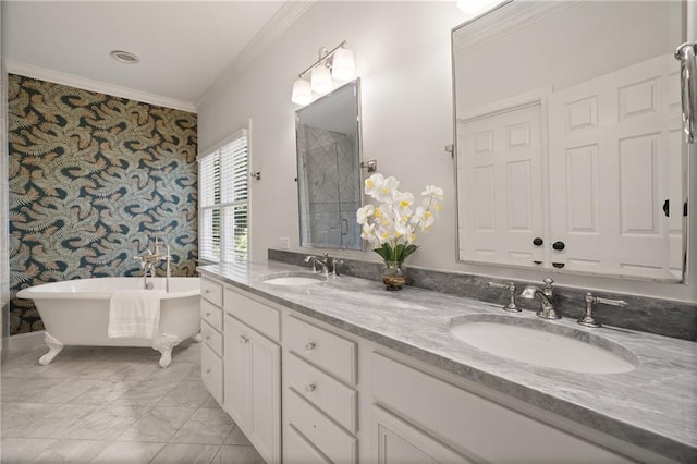 1003 N Ave NE, Atlanta, GA 30306 - full bathroom with wallpapered walls, crown molding, a freestanding bath, double vanity, and marble finish flooring