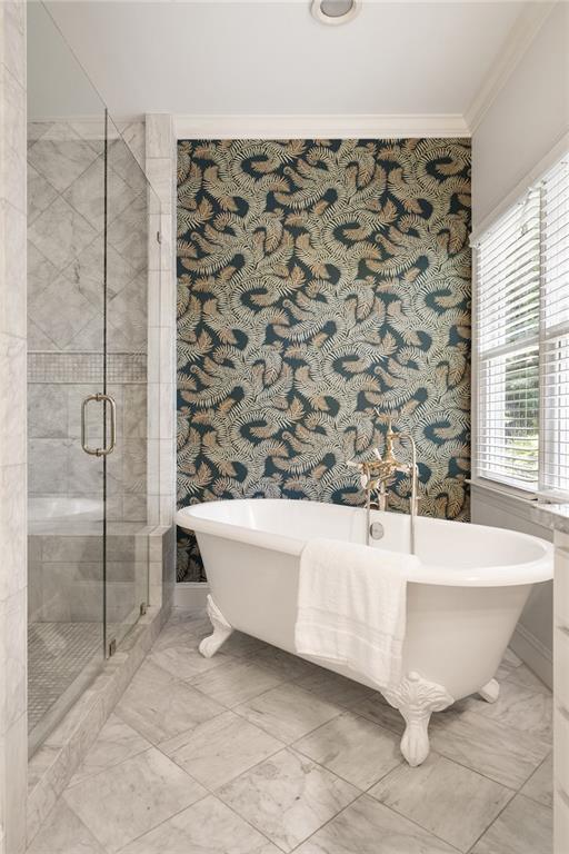 1003 N Ave NE, Atlanta, GA 30306 - full bathroom with crown molding, a shower stall, marble look tile flooring, a freestanding tub, and wallpapered walls