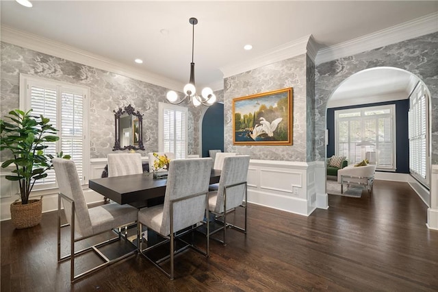 1003 N Ave NE, Atlanta, GA 30306 - dining space featuring wallpapered walls, arched walkways, wainscoting, wood finished floors, and crown molding