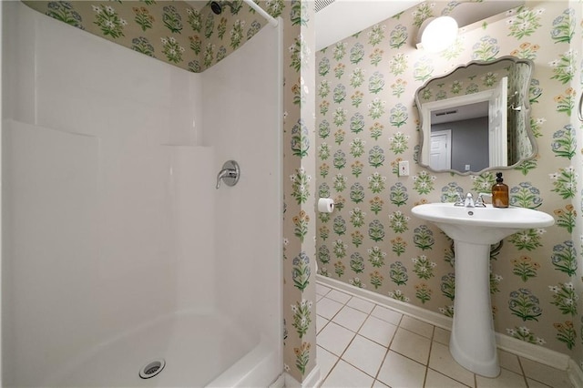 1003 N Ave NE, Atlanta, GA 30306 - bathroom with baseboards, tile patterned flooring, a stall shower, and wallpapered walls