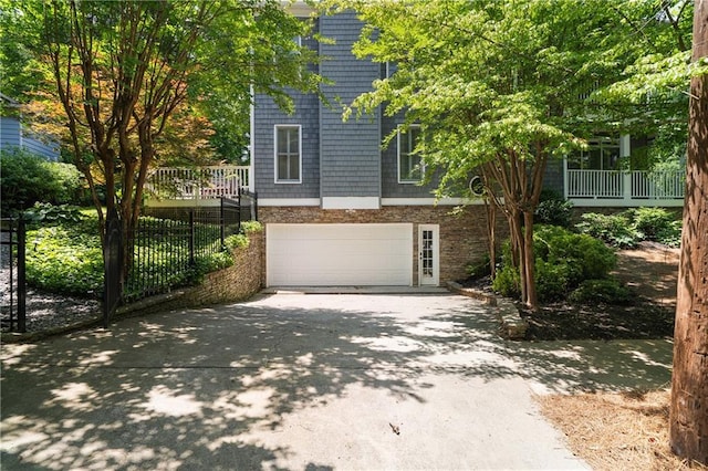1003 N Ave NE, Atlanta, GA 30306 - view of front of house featuring asphalt driveway and a garage