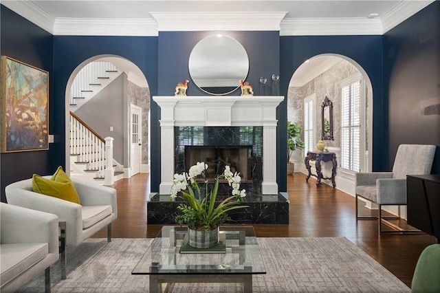 1003 N Ave NE, Atlanta, GA 30306 - living room with stairs, wood finished floors, a high end fireplace, and ornamental molding